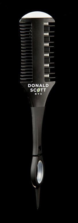 Comb suspended in air on infinite black background after post production fixes